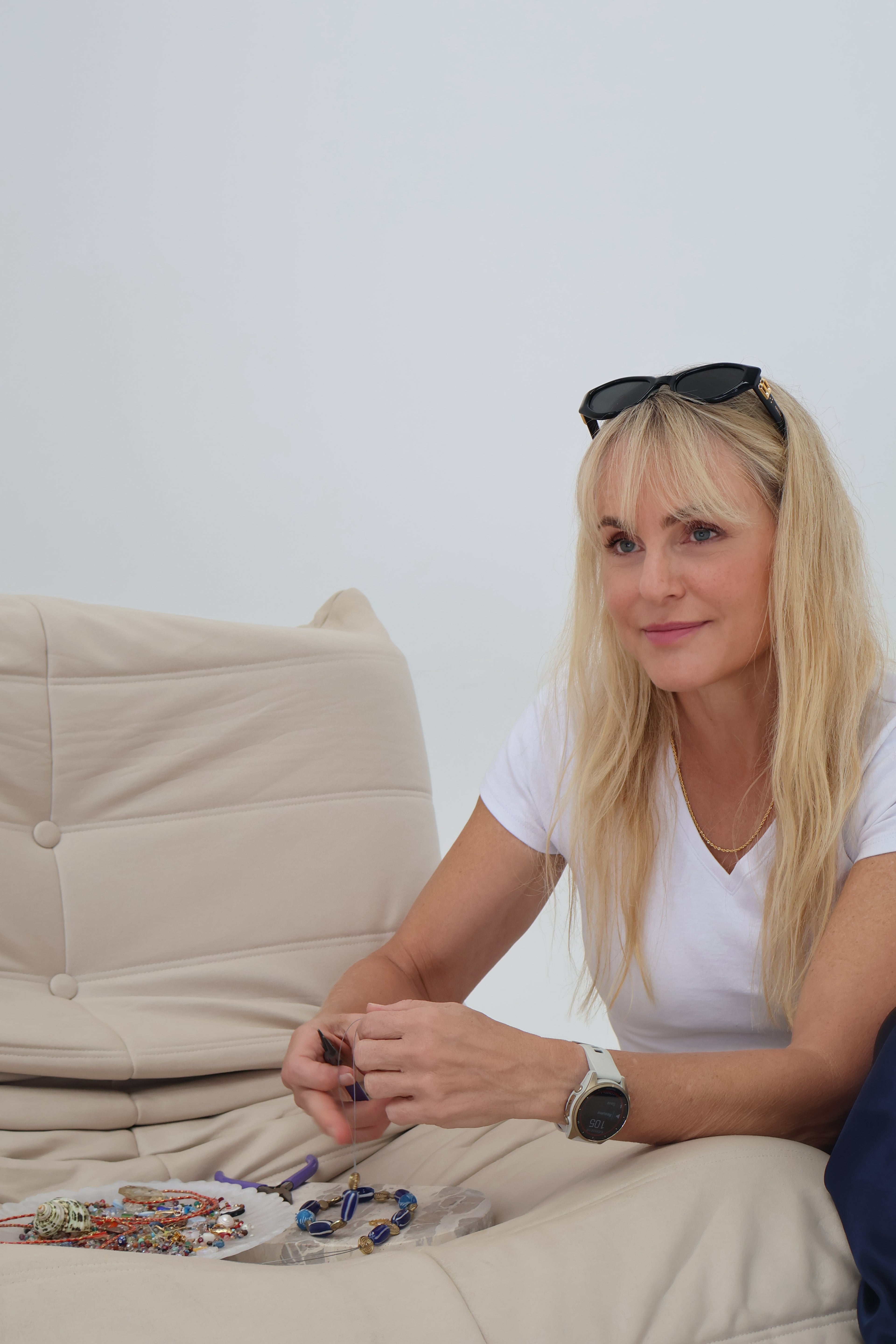 Mae hand-selecting gemstones and materials while designing Mae Bespoke jewellery
