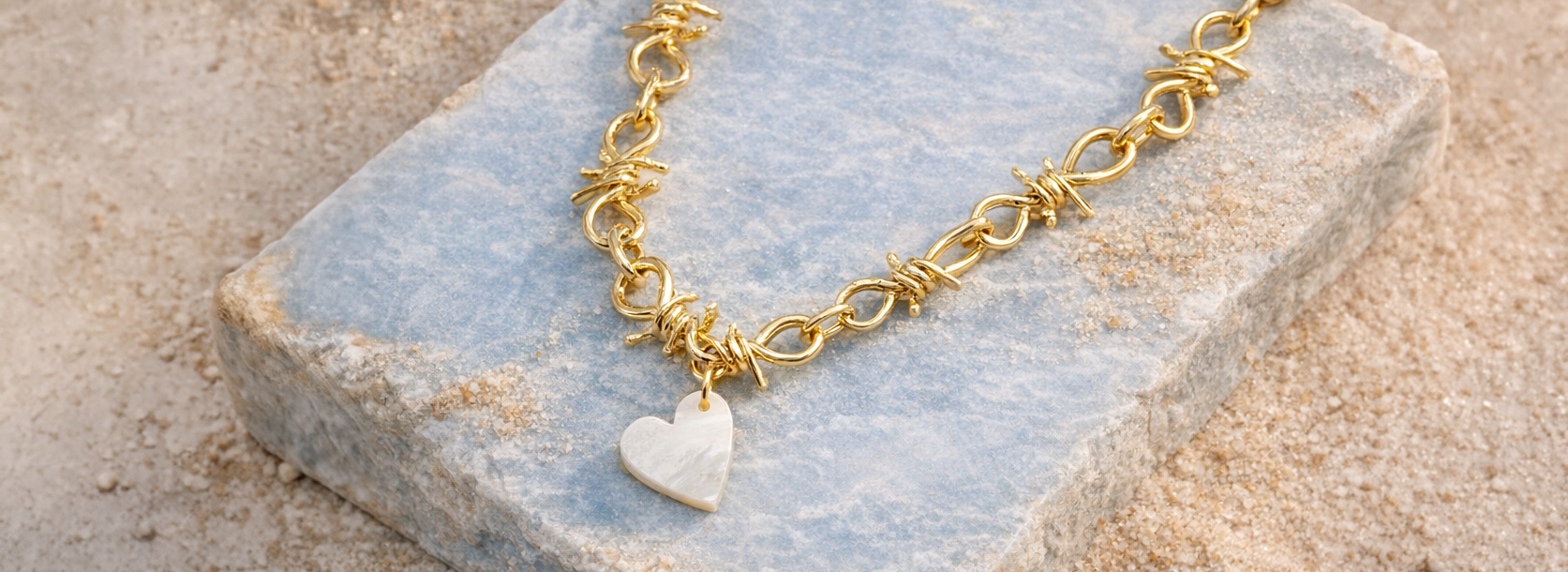 Gold-filled chain necklace with mother-of-pearl heart charm, handcrafted by Mae Bespoke